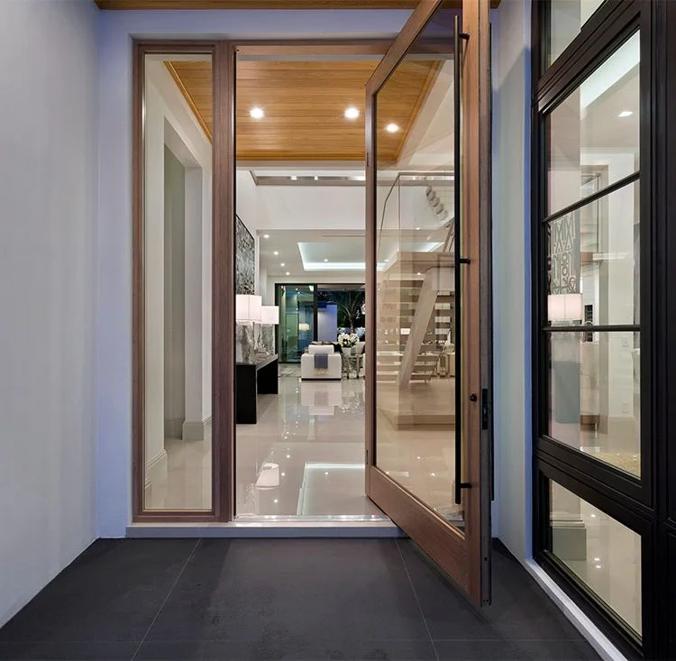 A wood-framed entry opening into a light-filled Delray Beach home